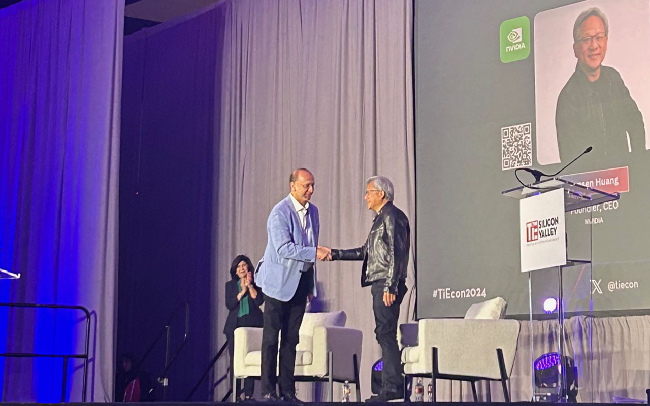 Navin Chaddha and Jensen Huang shake hands on the TiEcon 2024 stage